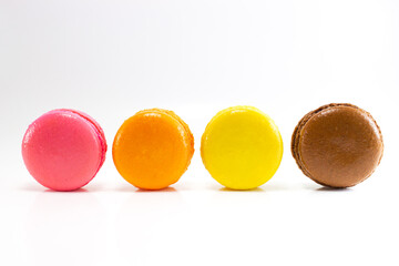 Homemade colorful macaroons on white isolate background. French dessert.