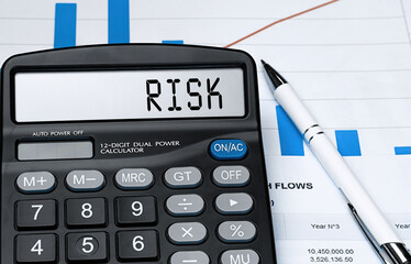 Calculator with the word risk on the display