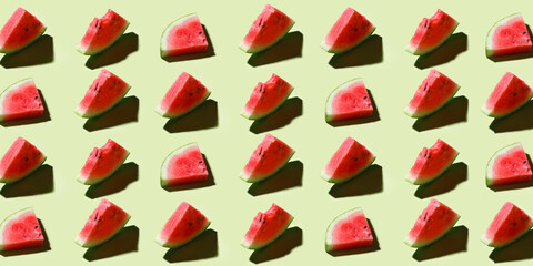watermelon pattern on green. Watermelon slices pattern viewed from above. Top view. Summer concept.