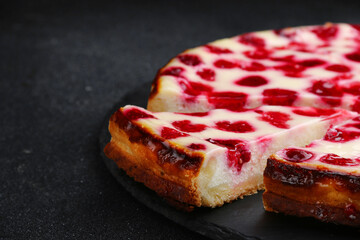 Homemade plum pie with sour cream on table