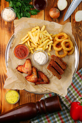set of beer snacks. appetizers and salty. Pile of food for big company. Party, sport bar, pub, restaurant menu