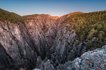 A large and picturesque gorge in the Tazi canyon in Turkey in the rays of the rising sun. A well-known tourist attraction and a place for active recreation and Hiking in Taurus mountains
