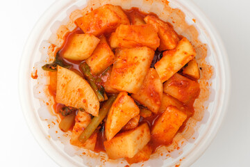 Radish kimchi on white background