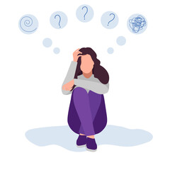 Depressed young girl is sitting on the sofa and thinking. Nearby is a red cat.