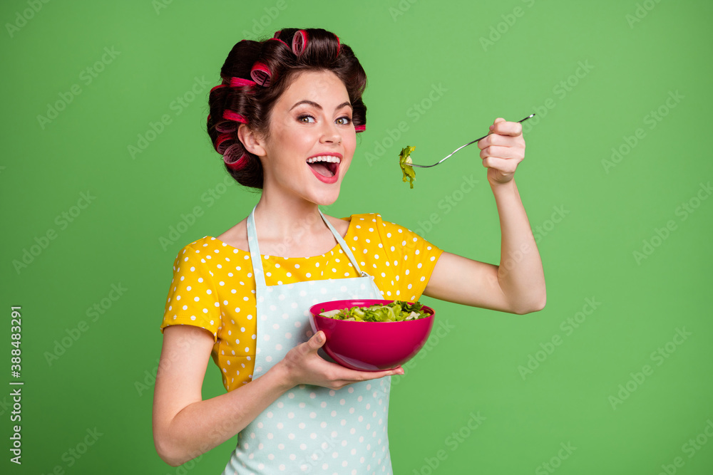 Sticker Turned photo of vintage veggie girl eat eco yummy salad bowl fork dinner lunch wear yellow dotted dress hair rollers isolated over green color background