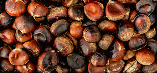 Roasted chestnuts as Background. Chestnuts close-up..