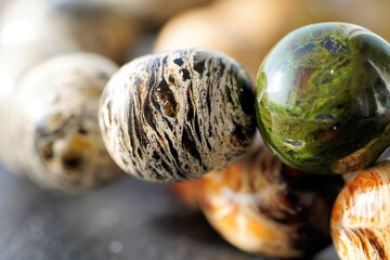 Close up view on brilliant natural rounded amber stones in sun light
