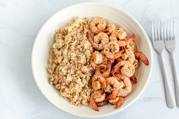 Cauliflower Rice and Sautéed Shrimp with Forks Directly Above Photo