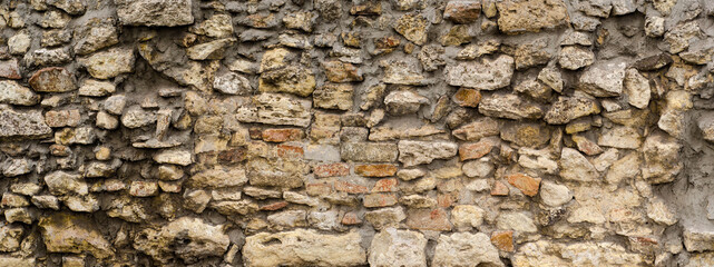 Old chalk stone fasade - rough grungy rock texture of limestone brick wall - HQ background