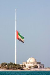 Large Abu Dhabi flag flying at half-mast