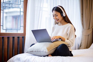 Asian woman relaxing at home.