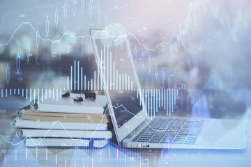 Stock market graph and table with computer background. Double exposure. Concept of financial analysis.