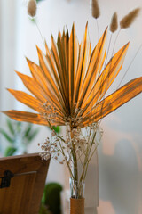 festive table composition. palm leaf golden closeup