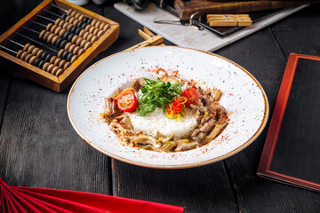 Roasted chicken with bell pepper and rice garnish