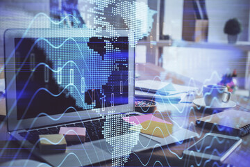 Financial market graph hologram and personal computer on background. Double exposure. Concept of forex.