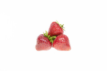 red raw fresh strawberries on white background, close view 