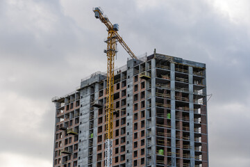 Fototapeta na wymiar Construction site with cranes on sky background