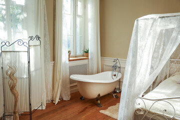bedroom interior with bath near the window