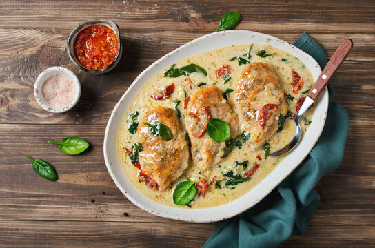 Chicken fillet with spinach and sun-dried tomatoes in coconut milk