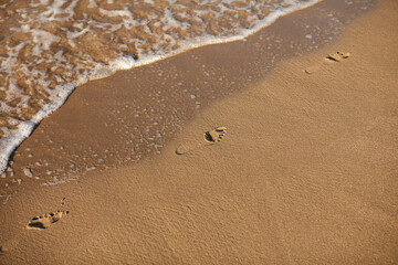 Fototapeta na wymiar footprints on the sand, Greece 