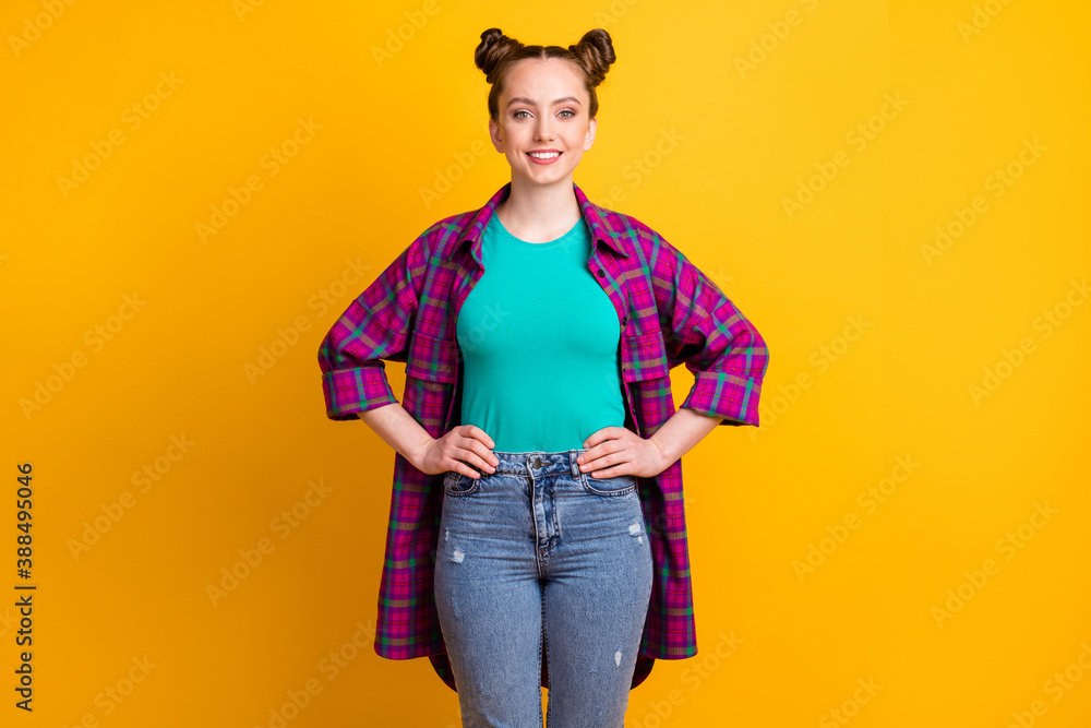 Canvas Prints photo of attractive pretty charming teen lady two funny buns hold hands by sides self-confident pers