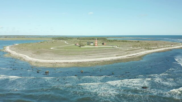Desolate lighthouse, aerial footage flying toward bautiful coastal area