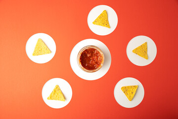 nachos with red tomato and chilli sauce