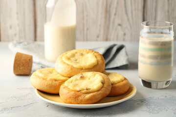 Cheesecakes with cottage cheese and raisins, round buns (Vatrushka),Passion fruit yogurt. Homemade baked goods