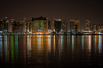 Fototapeta na wymiar Night skyline of the Abu Dhabi Corniche waterfront