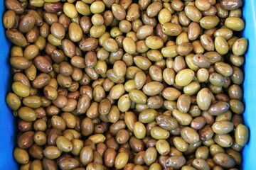 Stall with Kalamata or Kalamon olives at street market in Athens, Greece.