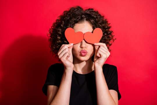 Photo of attractive curly hairstyle person hands cover eye heart paper figure isolated on red color background