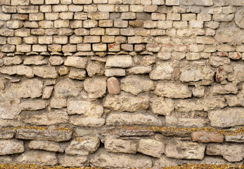 Old limestone brick grunge texture - photo with rough facade background