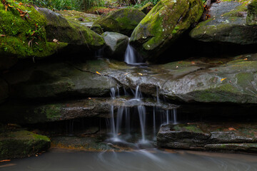 Close-up view of water flowing between rocks.
