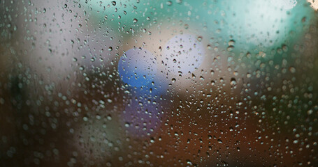 Heavy rain on the glass at night