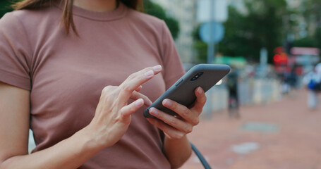 Woman use of mobile phone at street