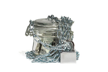 Dollar bills in a glass jar, closed on a chain with a lock. Money in bank. The concept of home banking, security, savings. Close-up, isolated white background, selective focus