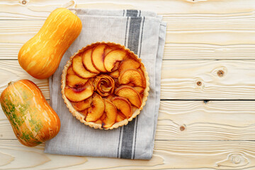 Top view of apple pie on wooden board