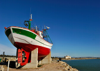 Colorful fishing boat on a dock near the Guardiana river in Guardamar del Segura, Alicante - Spain