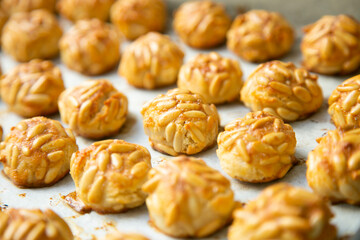 Almond and pine nuts Panellets . Traditional Catalan sweet made with potato, egg, sugar, almonds...