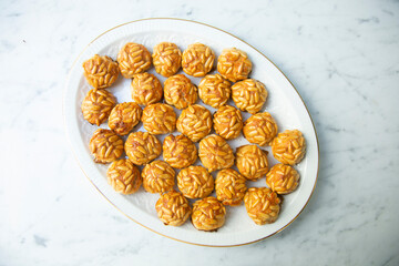 Almond and pine nuts Panellets . Traditional Catalan sweet made with potato, egg, sugar, almonds and pine nuts. Prepares to celebrate Halloween and November 1st