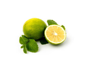 Lime with mint leaves isolated on white background.