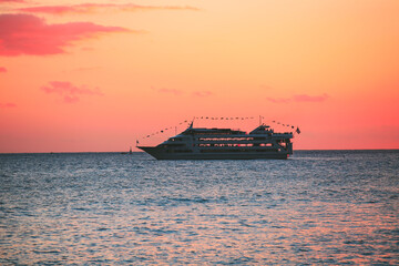 Sunset at Kakaako Waterfront Park, Honolulu, Oahu, Hawaii. cruise ship in the sea