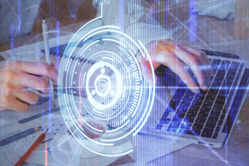 Double exposure of data internet theme hologram with man working on computer on background. Concept of innovation.