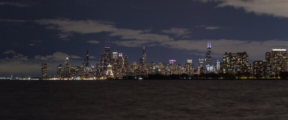 Nighttime panorama of Chicago skyline with clouds