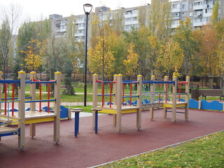 Children outdoor playground in a new residential area. Nobody. Comfortable safe urban environment. City living. Stay at home concept. Be safe. Gym Climbing Equipment. Childhood