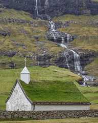 Saksun Church. Saksun is a village near the northwest coast of the Faroese island of Streymoy. Saksun lies in the bottom of what used to be an inlet of the sea, surrounded by high mountains.