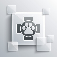 Grey Veterinary clinic symbol icon isolated on grey background. Cross hospital sign. A stylized paw print dog or cat. Pet First Aid sign. Square glass panels. Vector.