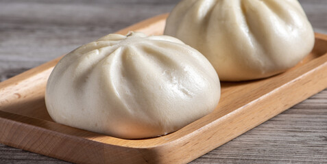 Close up of fresh delicious baozi, Chinese steamed meat bun.