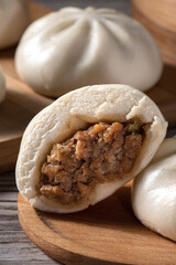Close up of fresh delicious baozi, Chinese steamed meat bun.