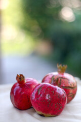 Fresh pomegranates, picked from the garden. Selective focus.